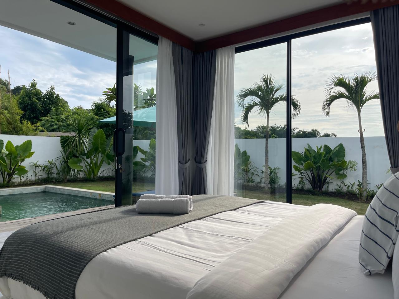 Contemporary villa for sale in Bali with poolside lounge